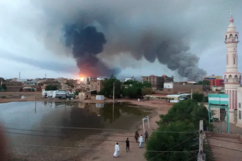 Sudan violence image from news site. Poof of black smoke in the air.