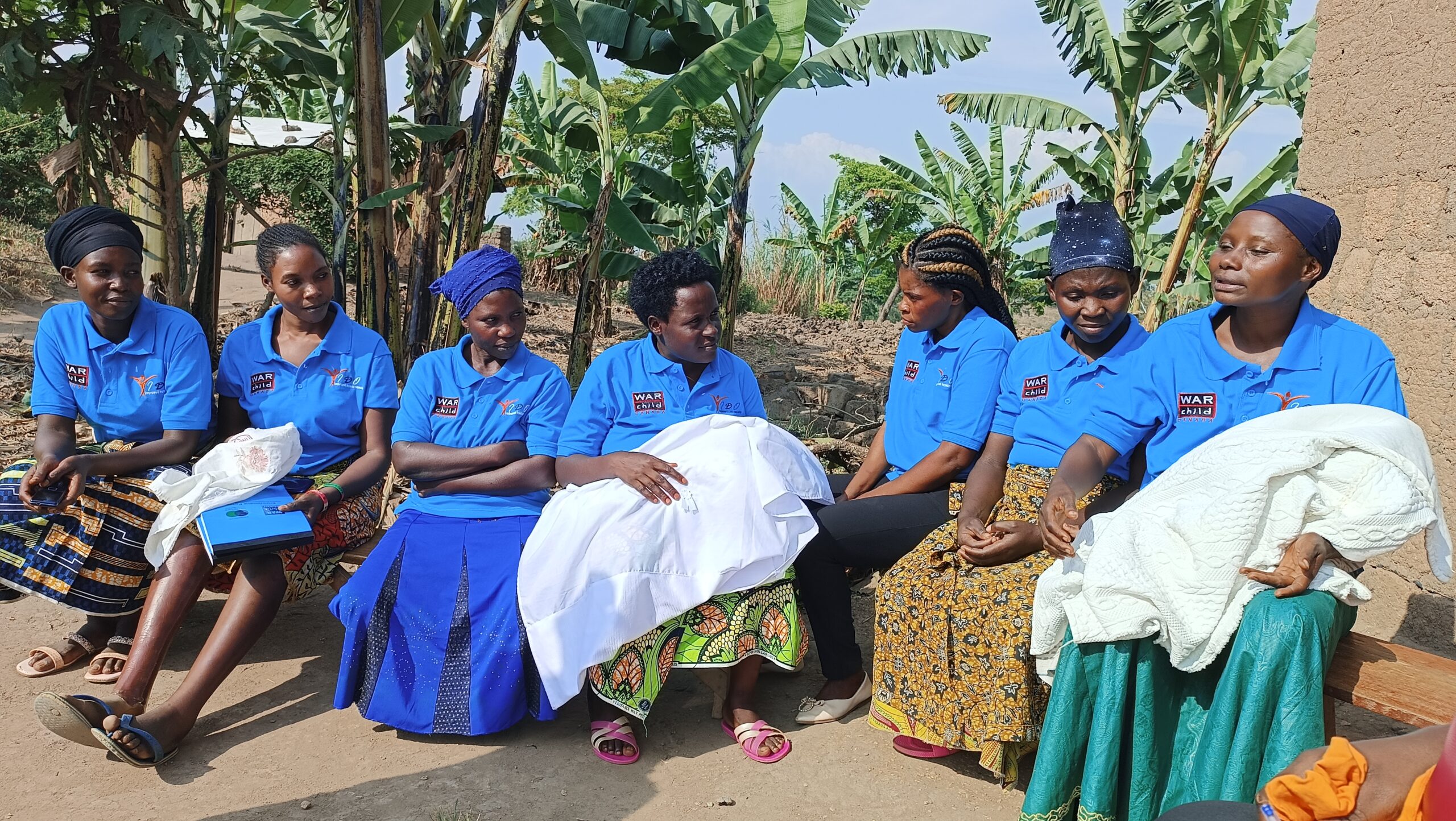 Mother to mother groups watch babies and children so their mothers can attend classes.